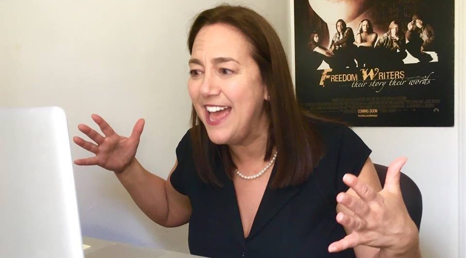 The Founder of the Freedom Writers Foundation, Erin Gruwell, enthusiastically hosting an educational group video chat.