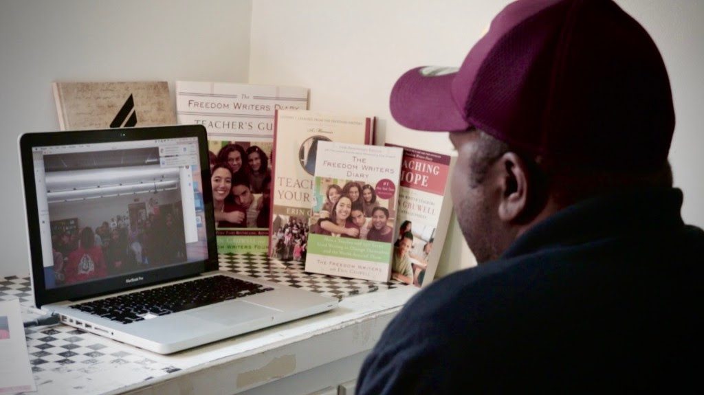 One of the Original 150 Freedom Writers hosts an enthralling video chat about his life and journey, with a class full of enthused students on his chat screen.